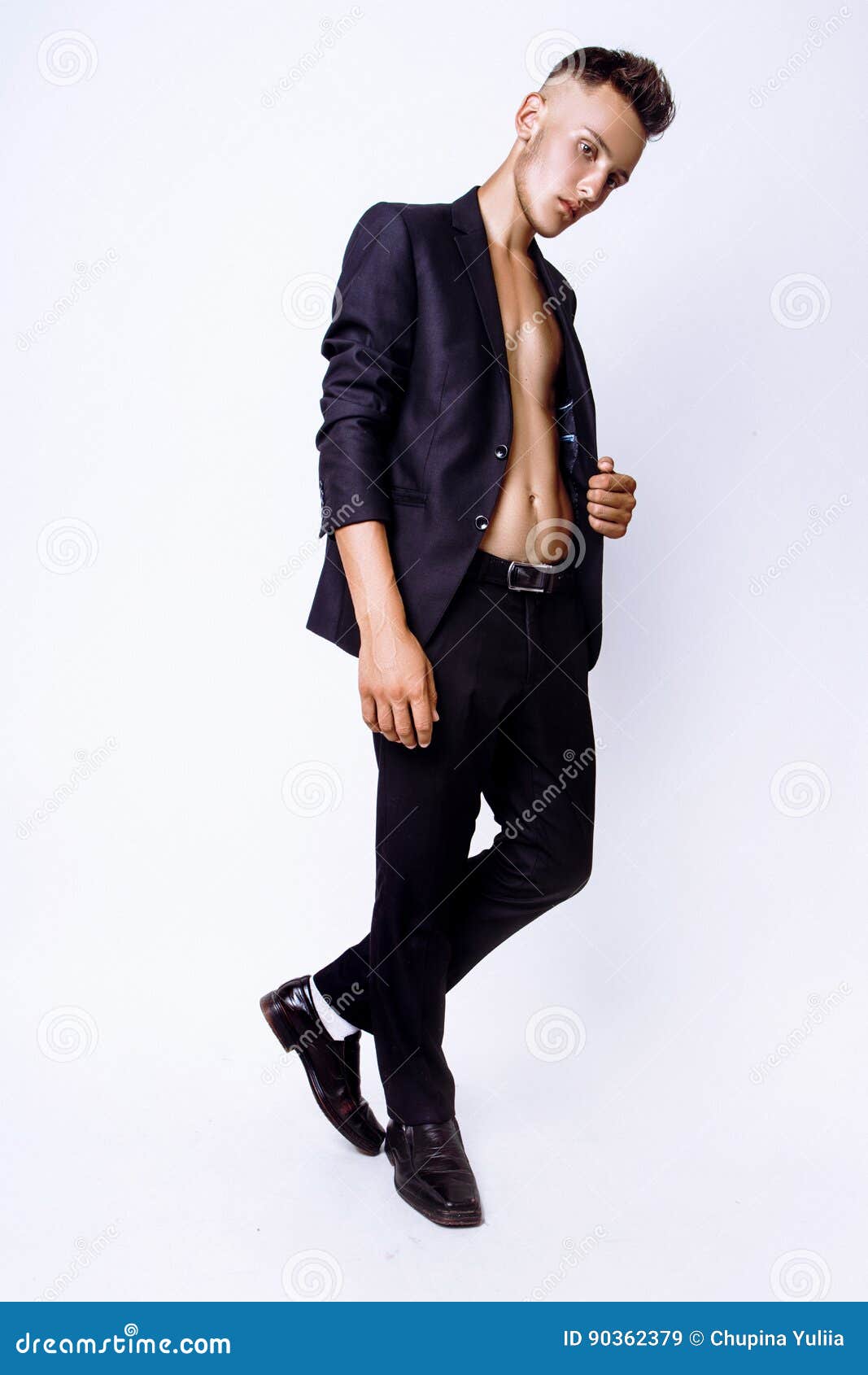 Image of Young Indian Male Model Wearing Suite Posing Over Grunge Wall  Background-QA796671-Picxy