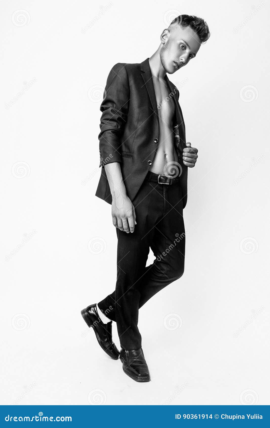young male model posing studio fashion businessman black suit casual poses black white 90361914