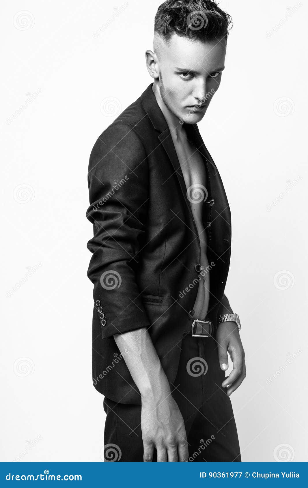 Studio fashion pose by a handsome young male model, with fashion tone and  background Stock Photo - Alamy
