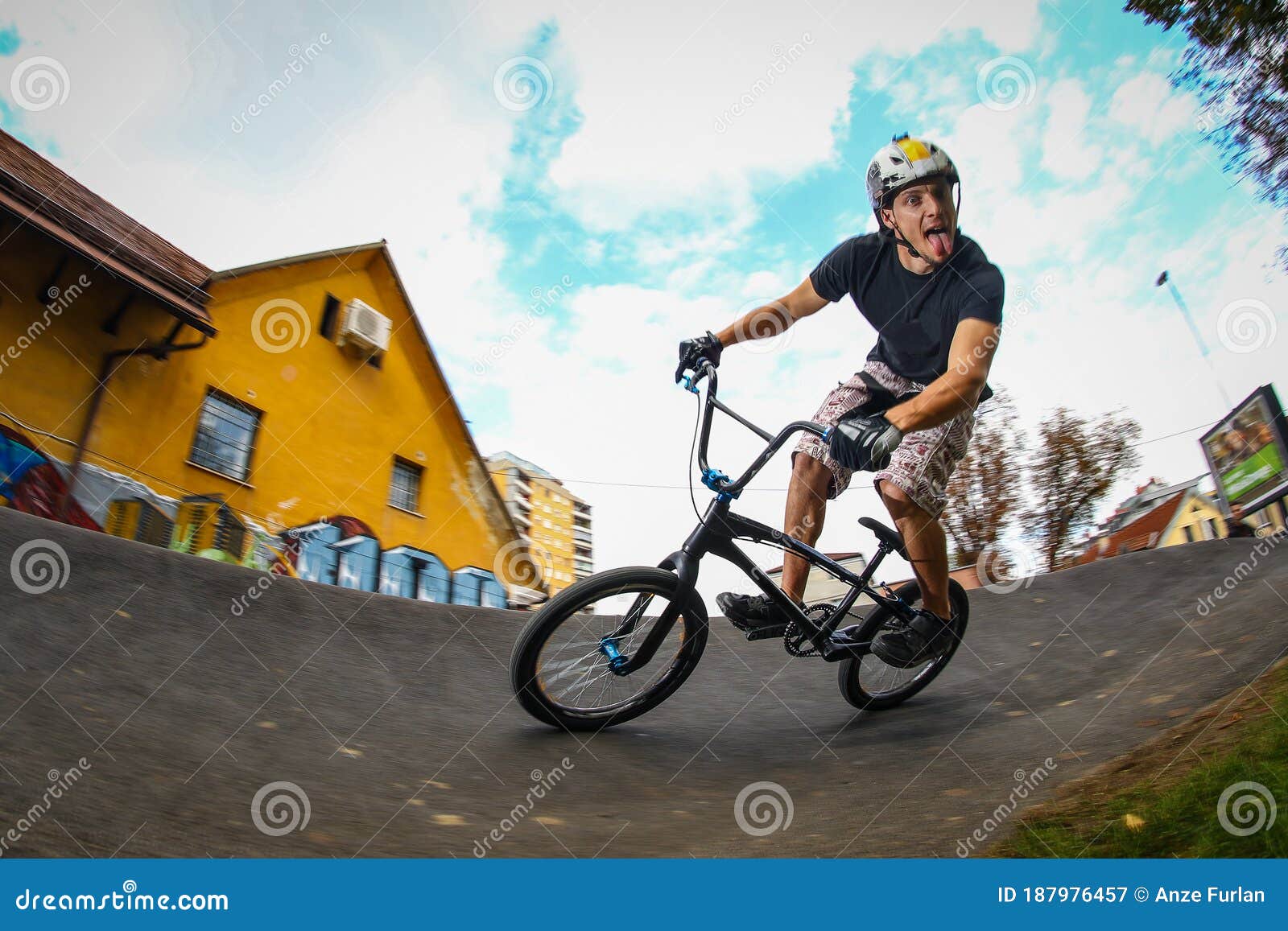 A Young Male Riding BMX Bike through a Berm Stock Image Image of