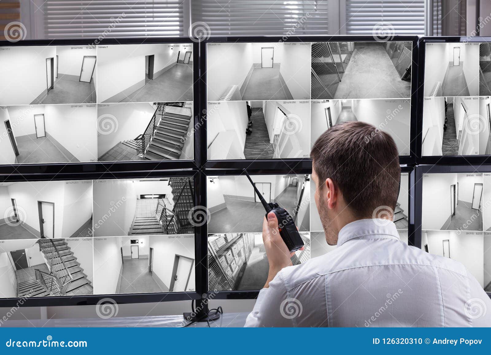 security guard monitoring cctv footage