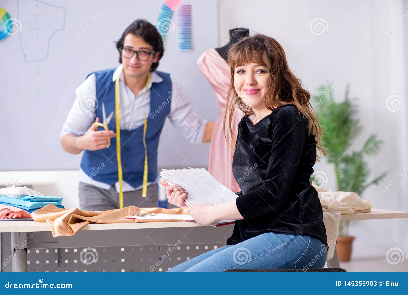 The Young Male Tailor Teaching Female Student Stock Image - Image of ...