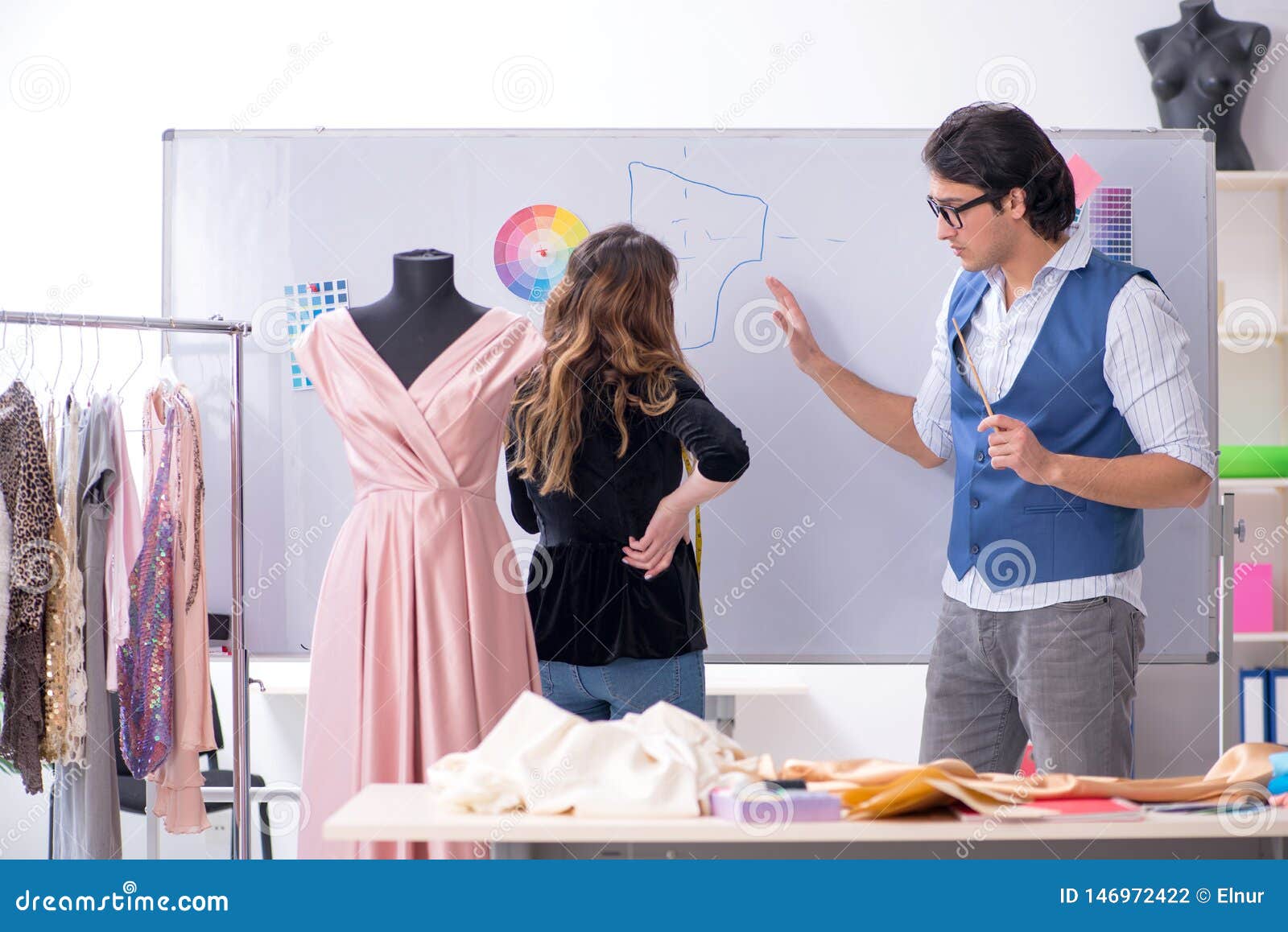 The Young Male Tailor Teaching Female Student Stock Photo - Image of ...