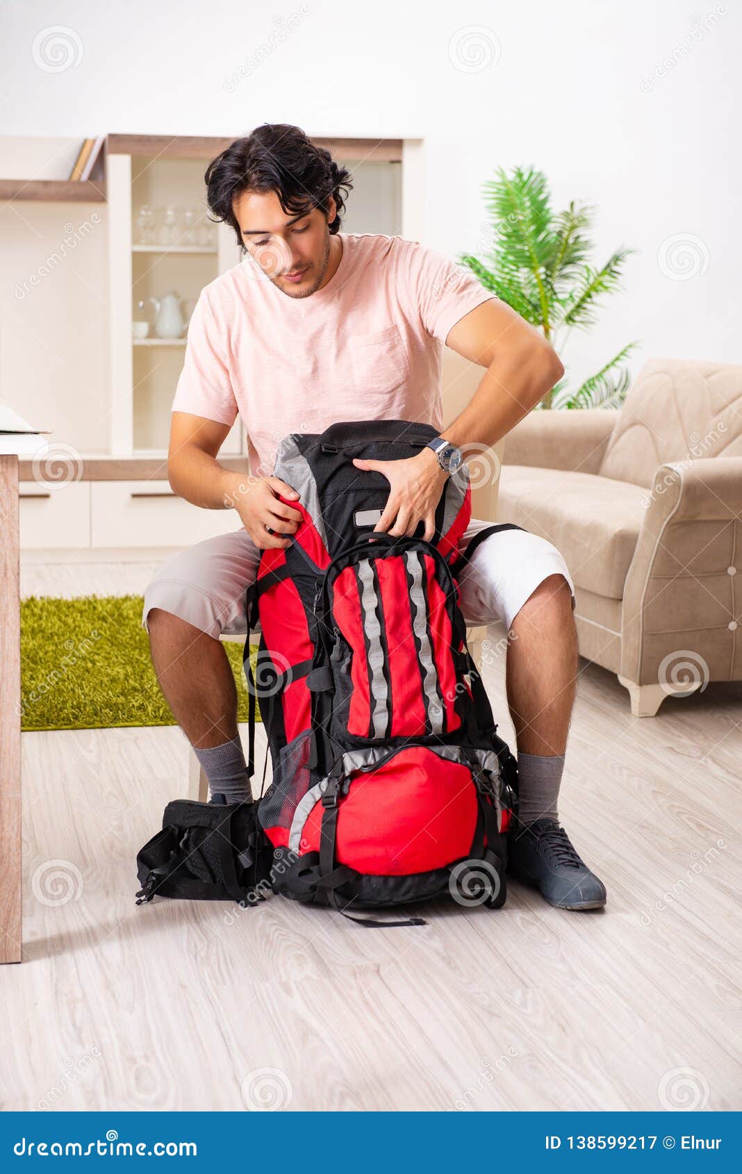 The Young Male Tourist Preparing for Trip at Home Stock Image - Image ...