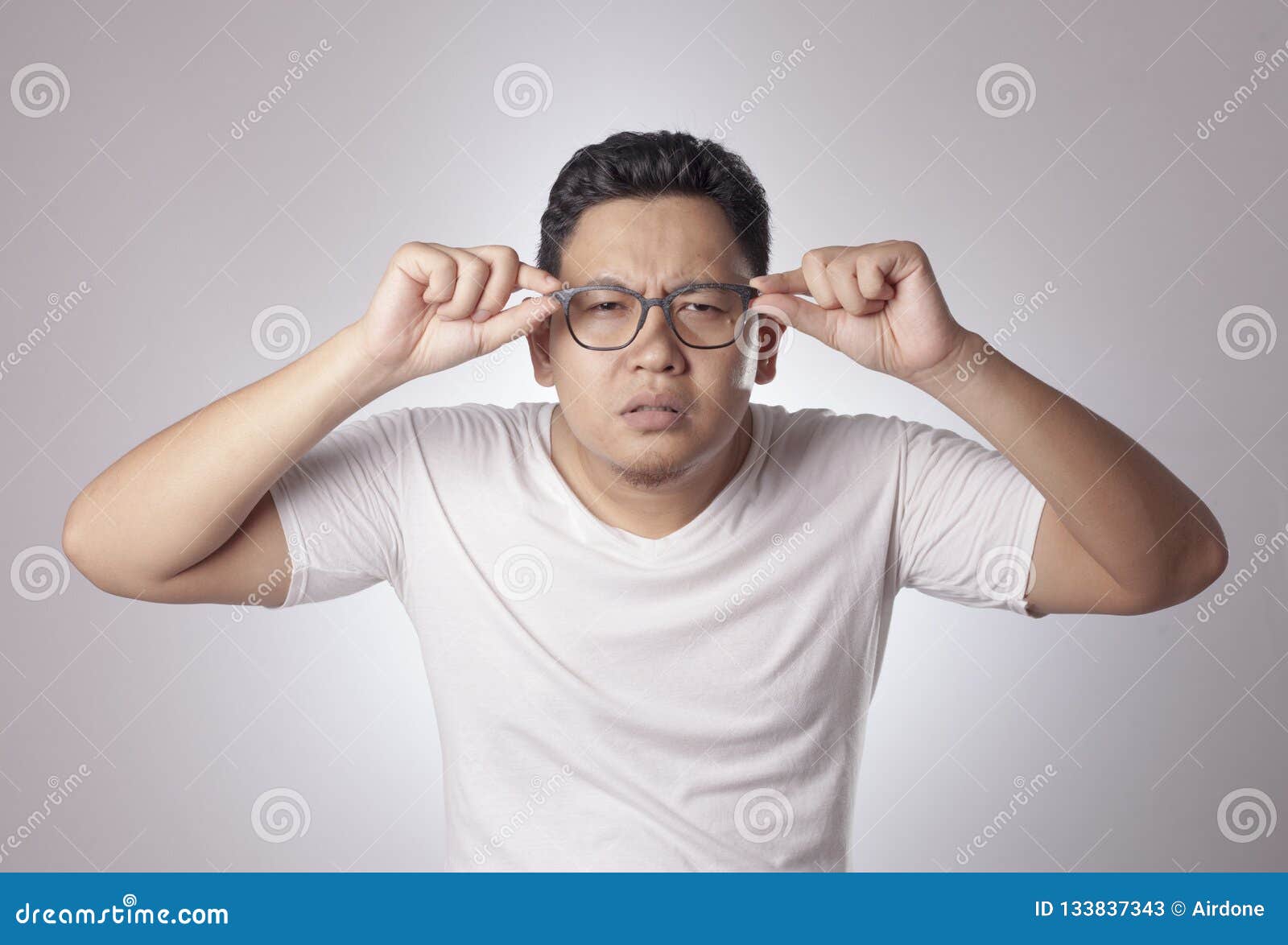 Young Man Adjusting His Eyeglasses Stock Image Image of face