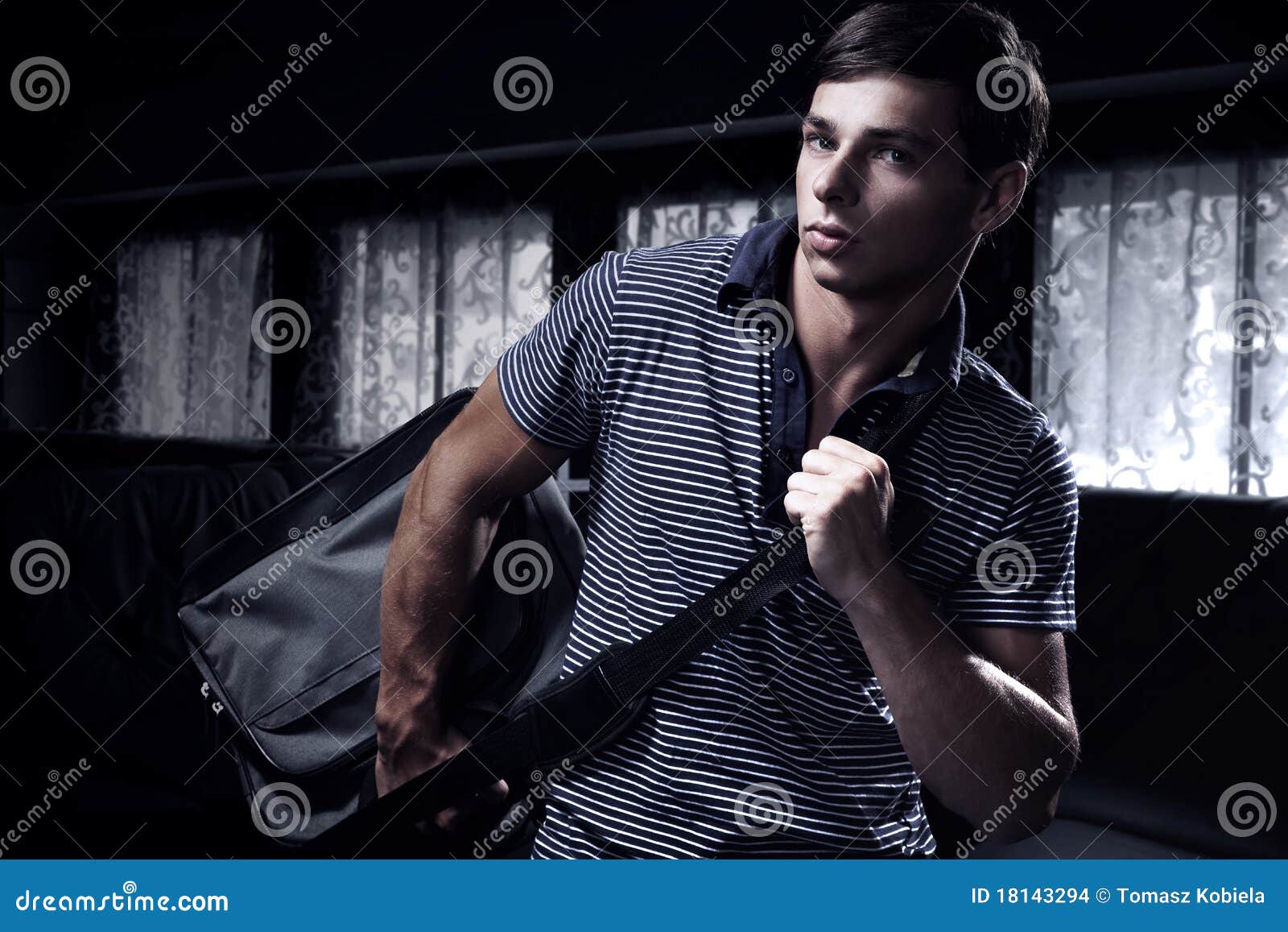 Young man with a bag stock photo. Image of masculine 18143294