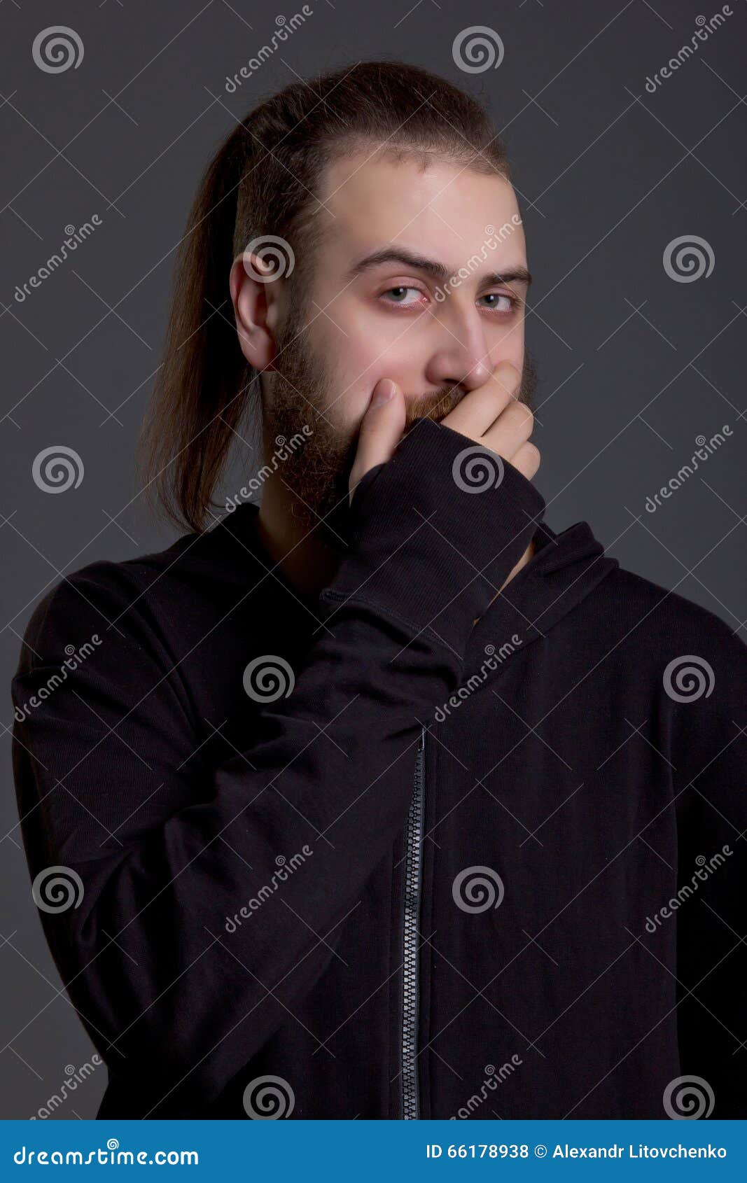 Young Man with a Beard Covers Her Mouth Stock Photo Image of male