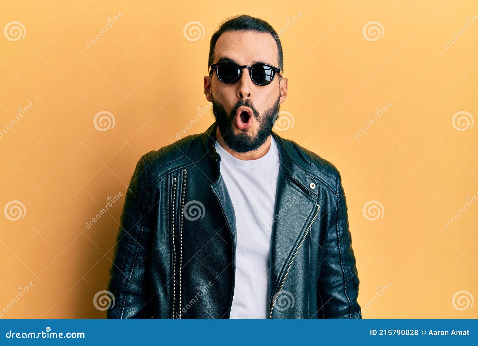 Young Man with Beard Wearing Black Leather Jacket and Sunglasses Scared and  Amazed with Open Mouth for Surprise, Disbelief Face Stock Photo - Image of  black, surprise: 215790028