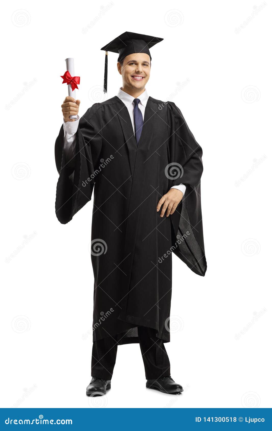Young Man In A Black Graduation Gown And Cap Holding A Diploma Stock ...