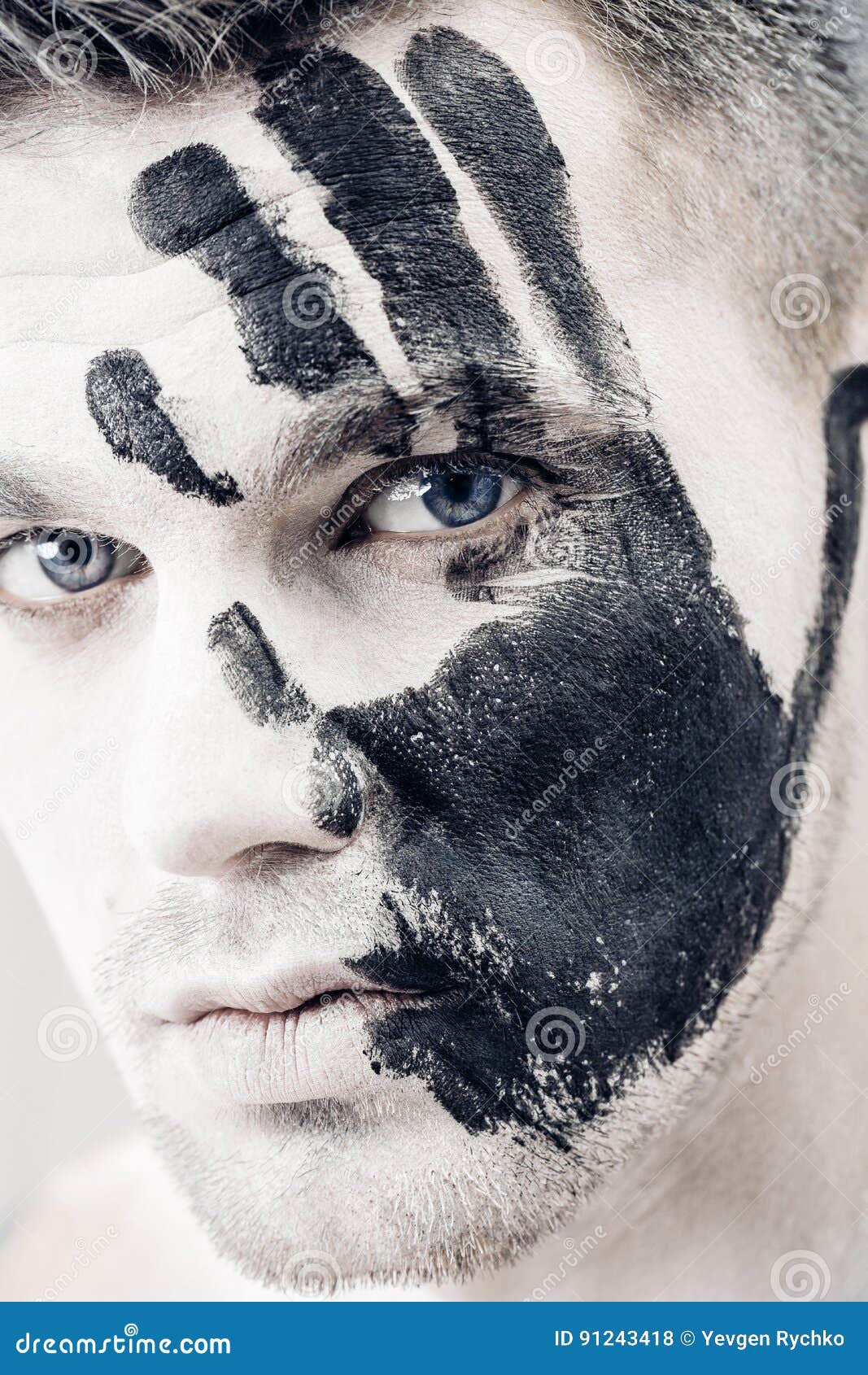 portrait of young man with white face paint. Professional Fashion