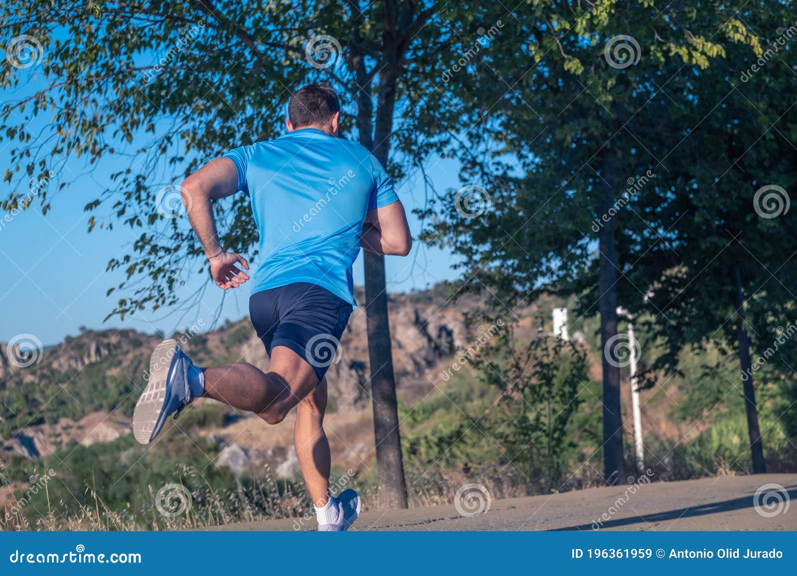 Young Man in Blue T-shirt Running through a Park Stock Image - Image of ...