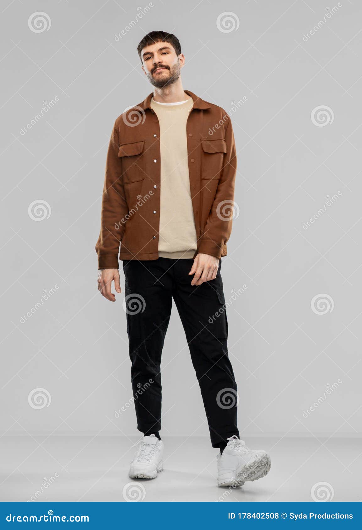 A Guy in a Sand Jacket and Gray Pants with Black Shoes a Straw Hat and a  Beard is Sitting on a Street Bench Stock Photo  Image of gentleman  bearded 183860276