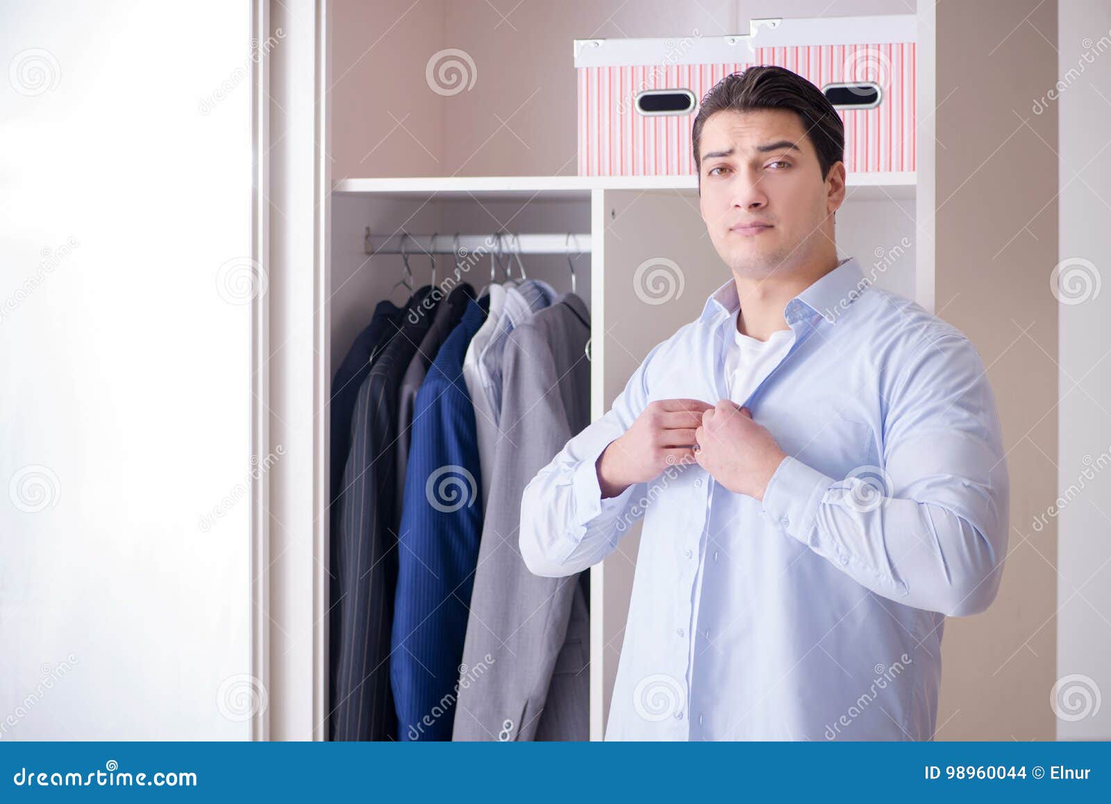The Young Man Businessman Getting Dressed for Work Stock Photo Image