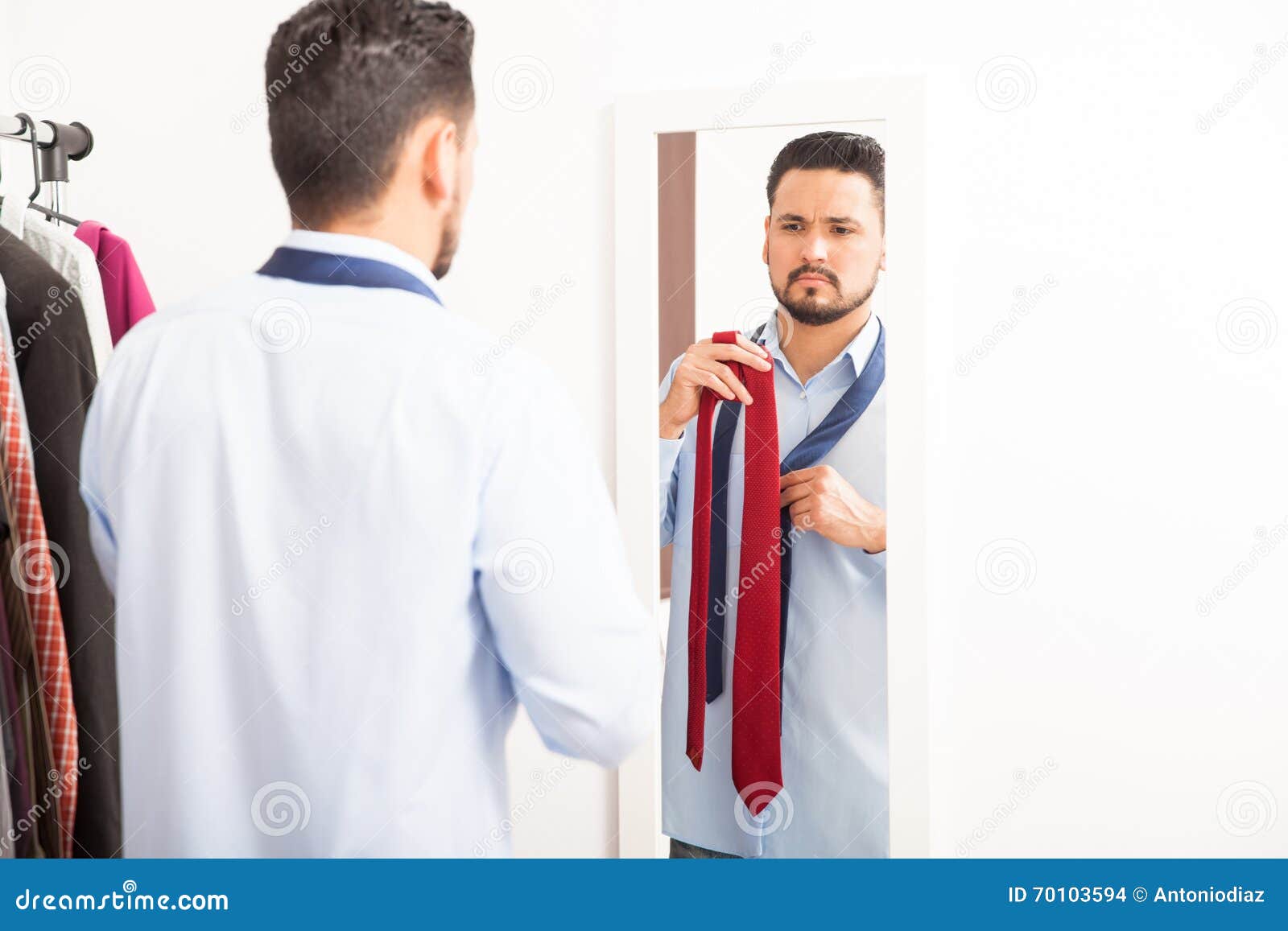 Young Man Choosing Tie in Front of a Mirror Stock Photo Image of
