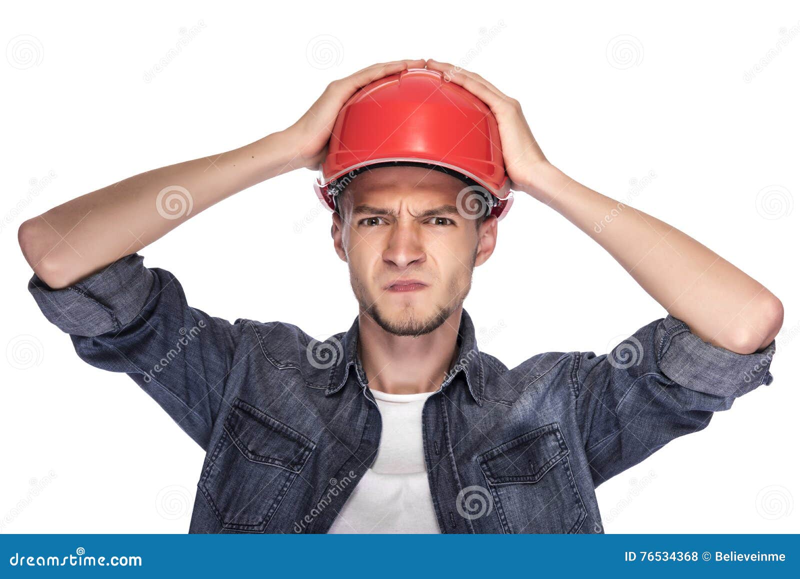 Young Man in a Construction Helmet. Stock Photo Image of portrait