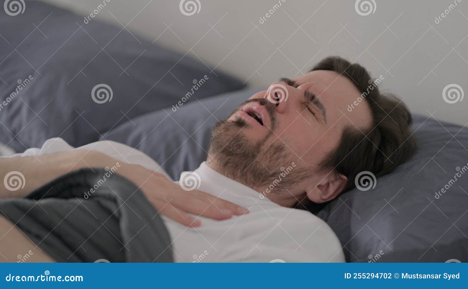 Young Man Coughing while Sleeping in Bed Stock Photo Image of