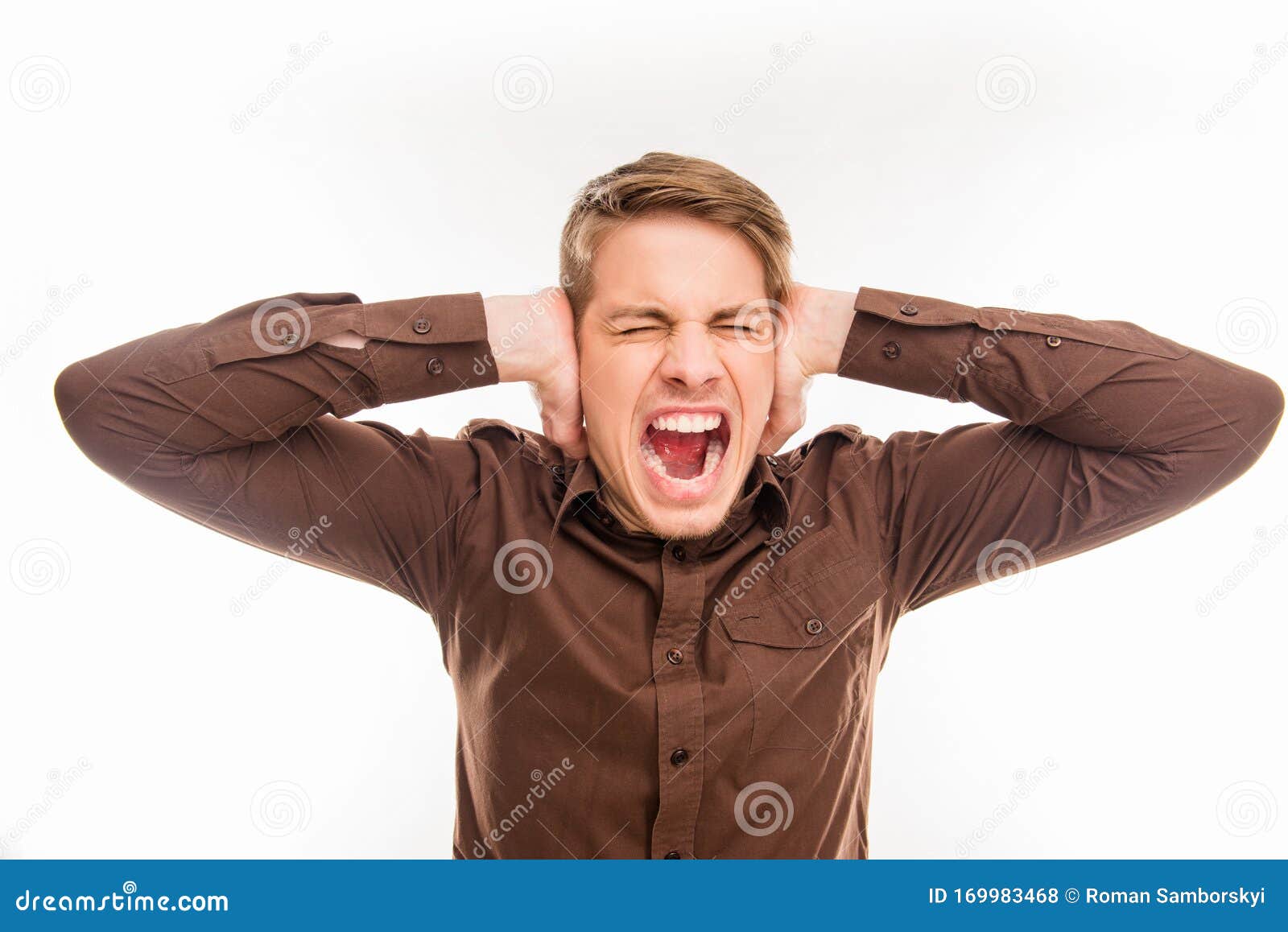 Young Man Covering His Ears and Shouting Stock Photo Image of close