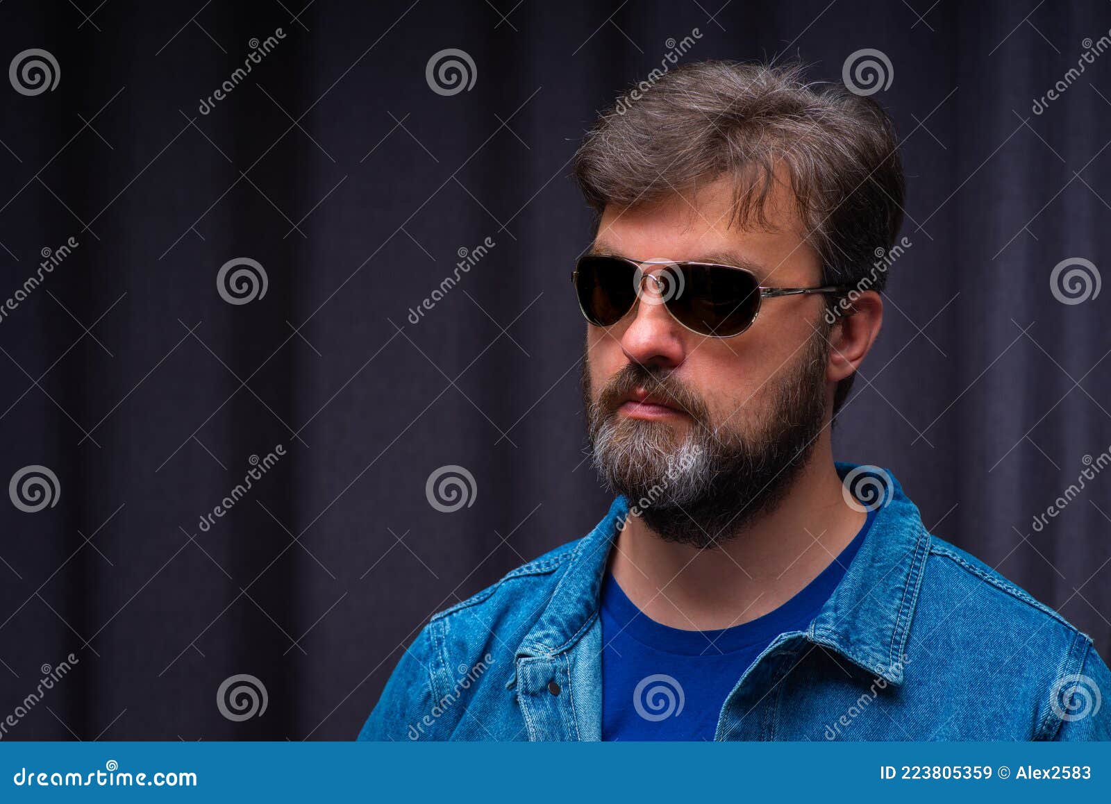 A Young Man in Dark Glasses and a Denim Jacket Close-up Stock Image ...