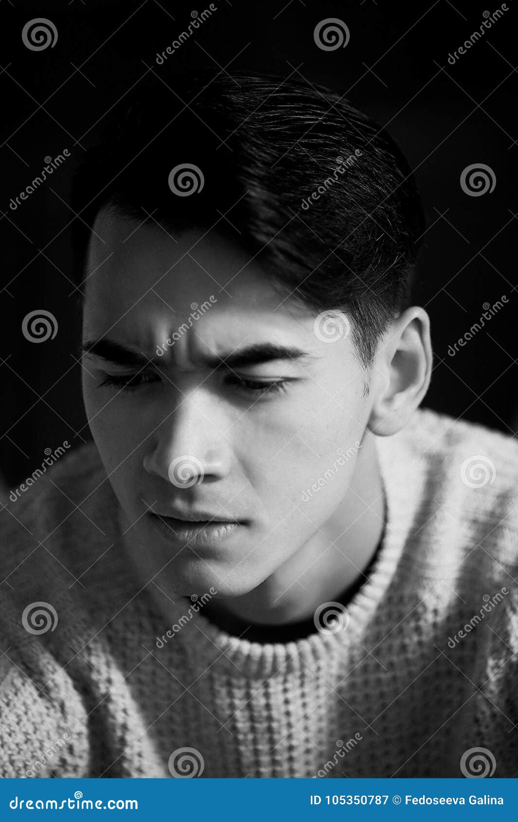 A Young Man with Dark Hair and Eyes Frowns.Reverie Stock Image - Image ...