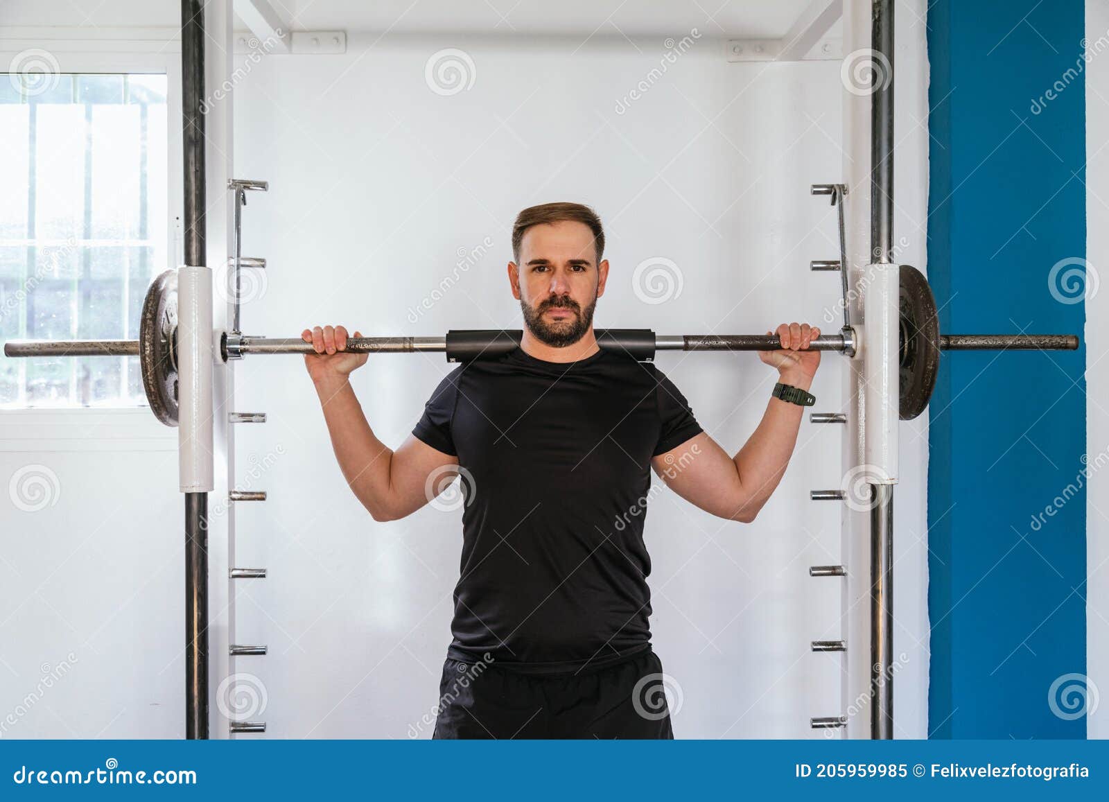 Young Man Doing Squats at the Gym, . Bar Exercise Stock Image Image