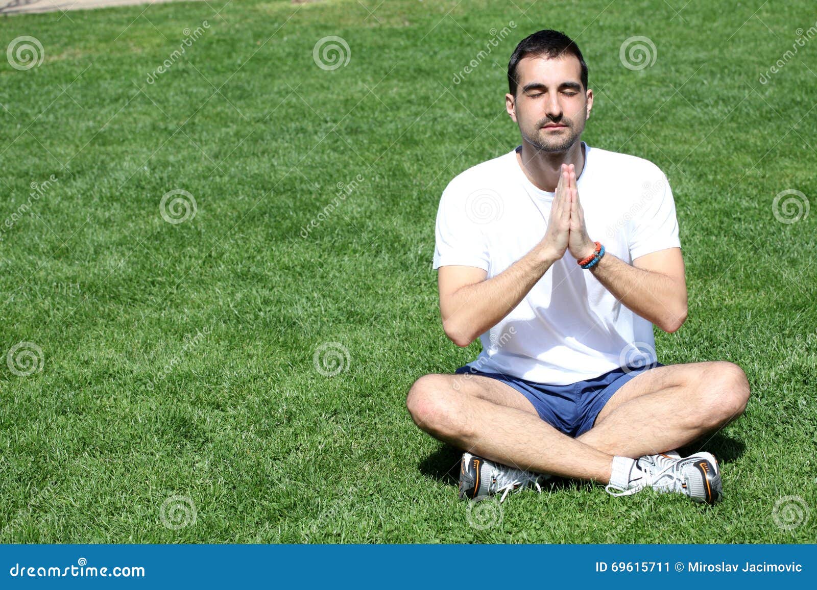 Young man doing yoga stock image. Image of flexible, healthy - 69615711