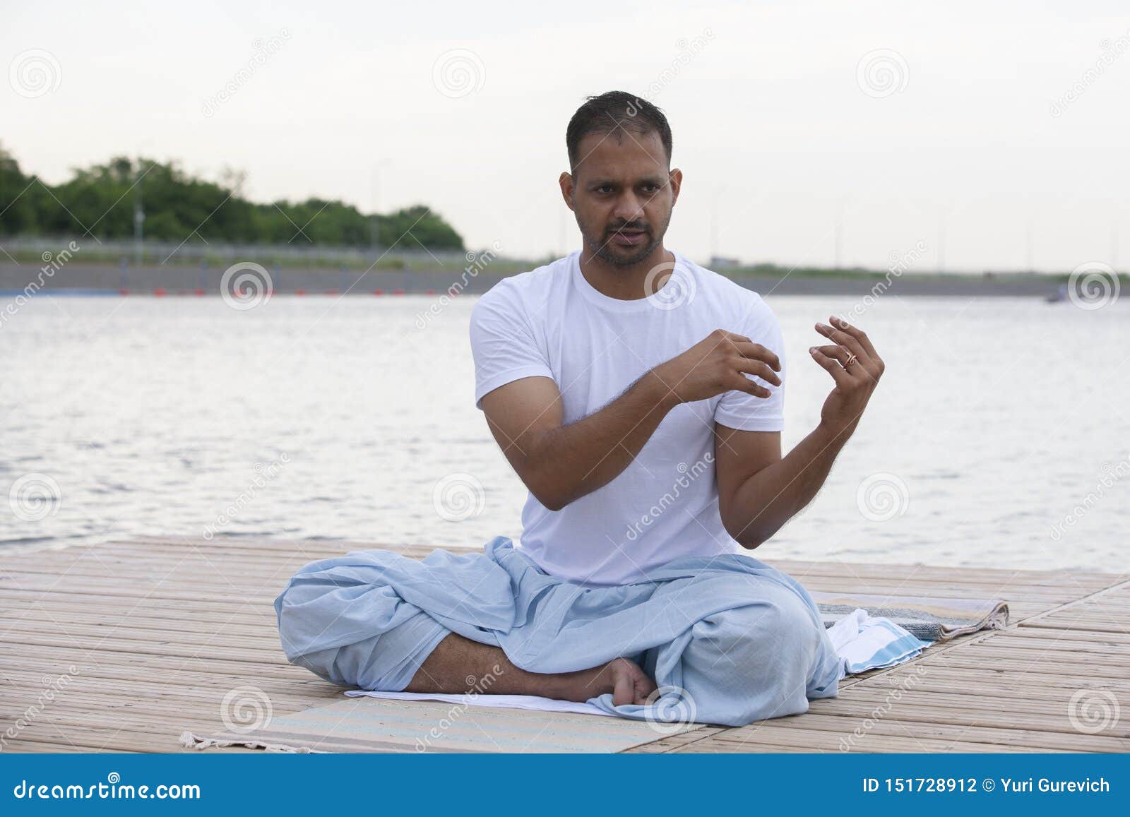 Young Man Doing Yoga in Morning Park.man Relax in Nature Stock Photo ...