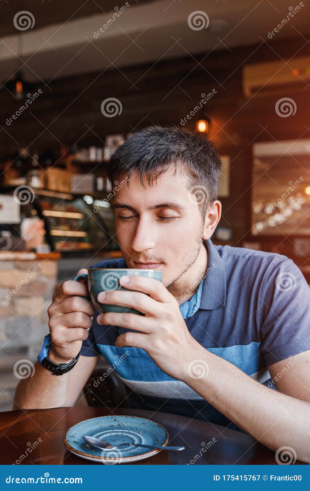 Man Drinks Aromatic Coffee in a Cafe or Cafeteria Stock Image Image