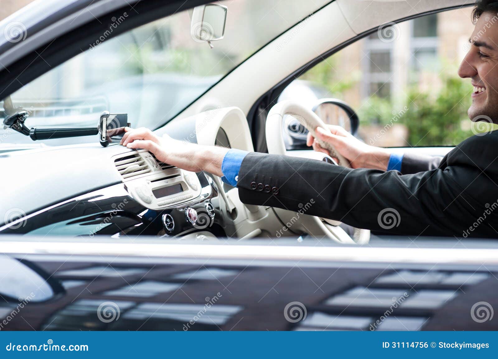 Young Man Driving a Nice Car, Using Gps Device Stock Photo Image of