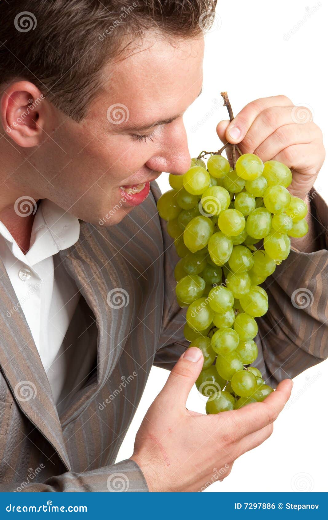 Young Man Eats Green Grapes Stock Photo Image of gourmet, holding