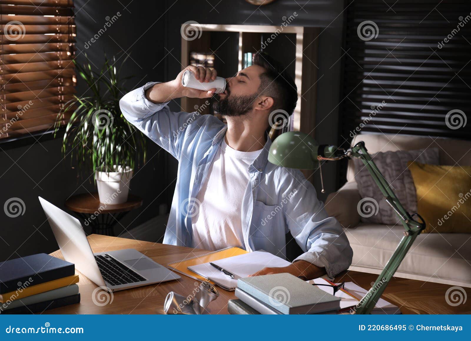 Young Man with Energy Drink Studying Stock Image Image of energetic, adult 220686495