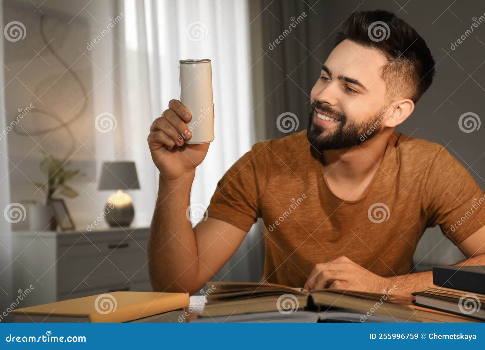 Young Man with Energy Drink Studying at Home Stock Image Image of