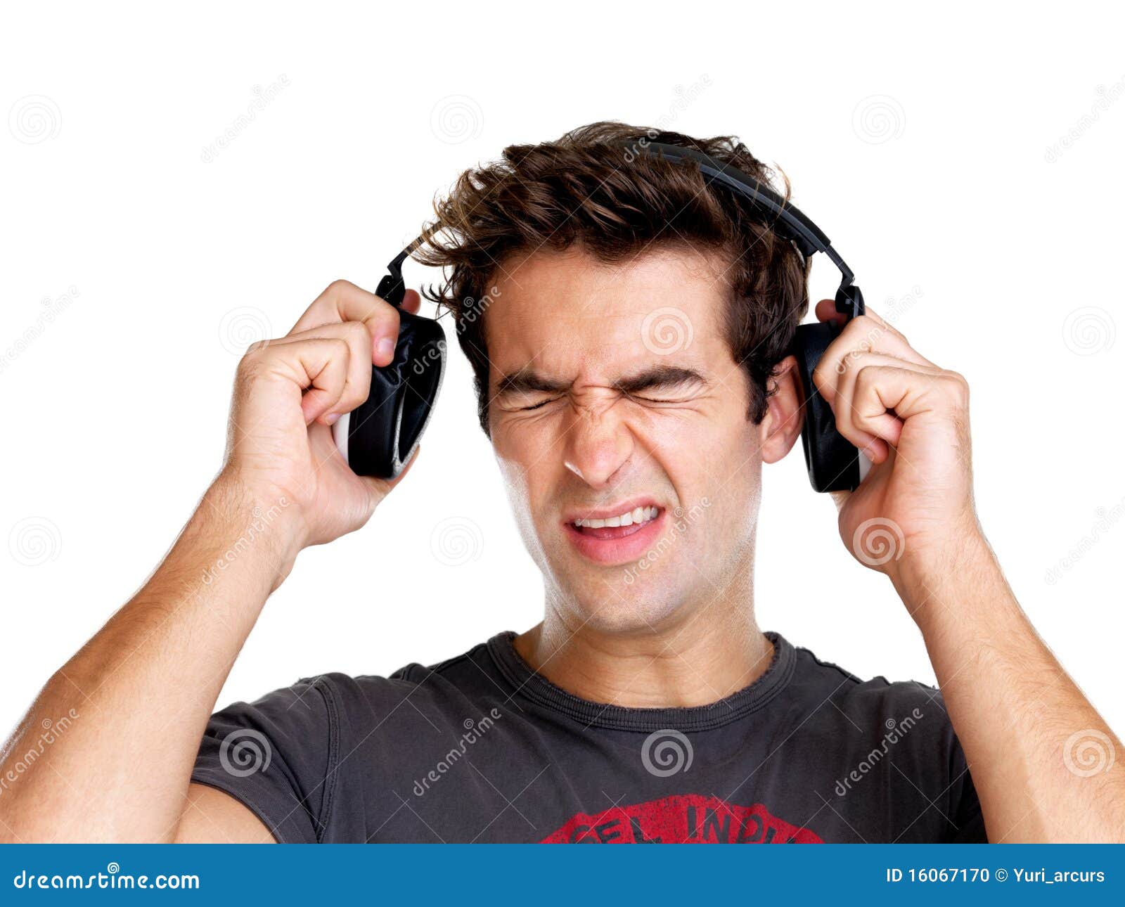 Young Man Expressing Loud Sound Over The Headphone Stock Photo Image