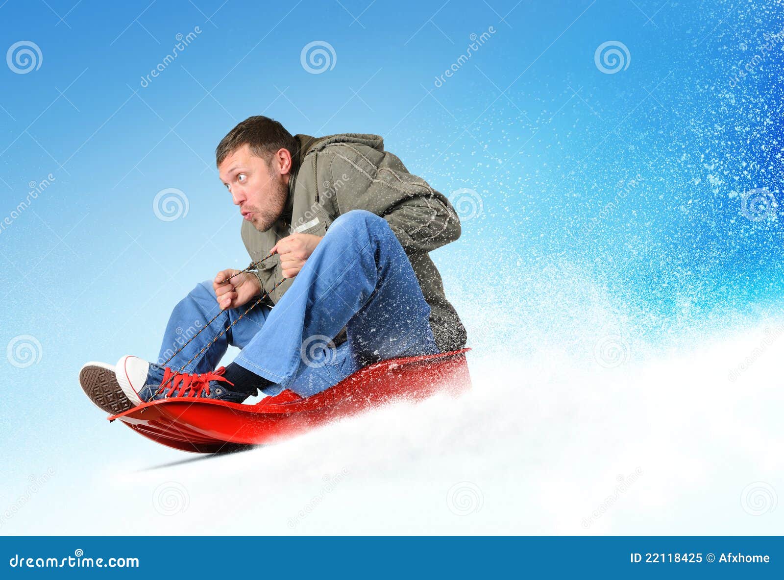 young man flies on sled in the snow