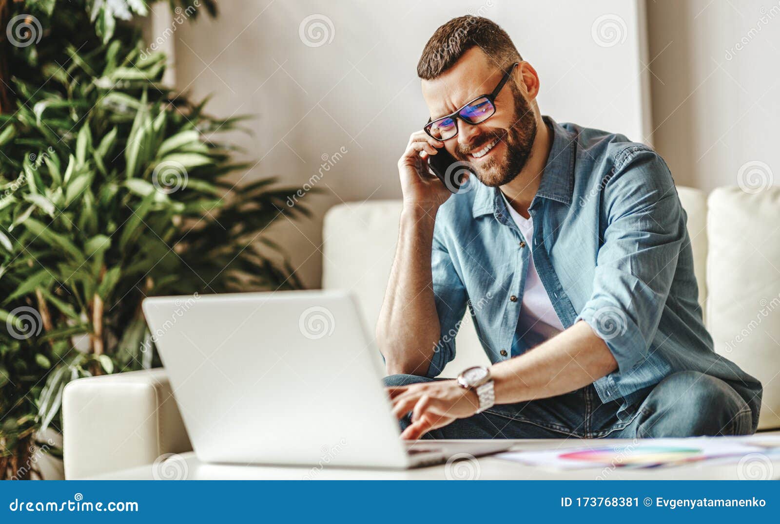 young   man freelancer working at home on a computer