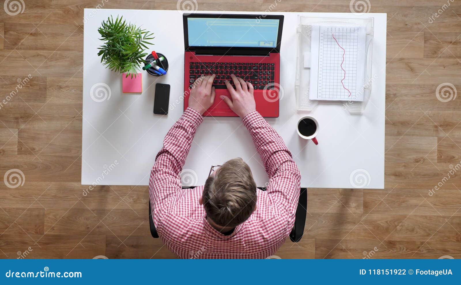 Young Man In Glasses Working And Typing On Laptop Somebody