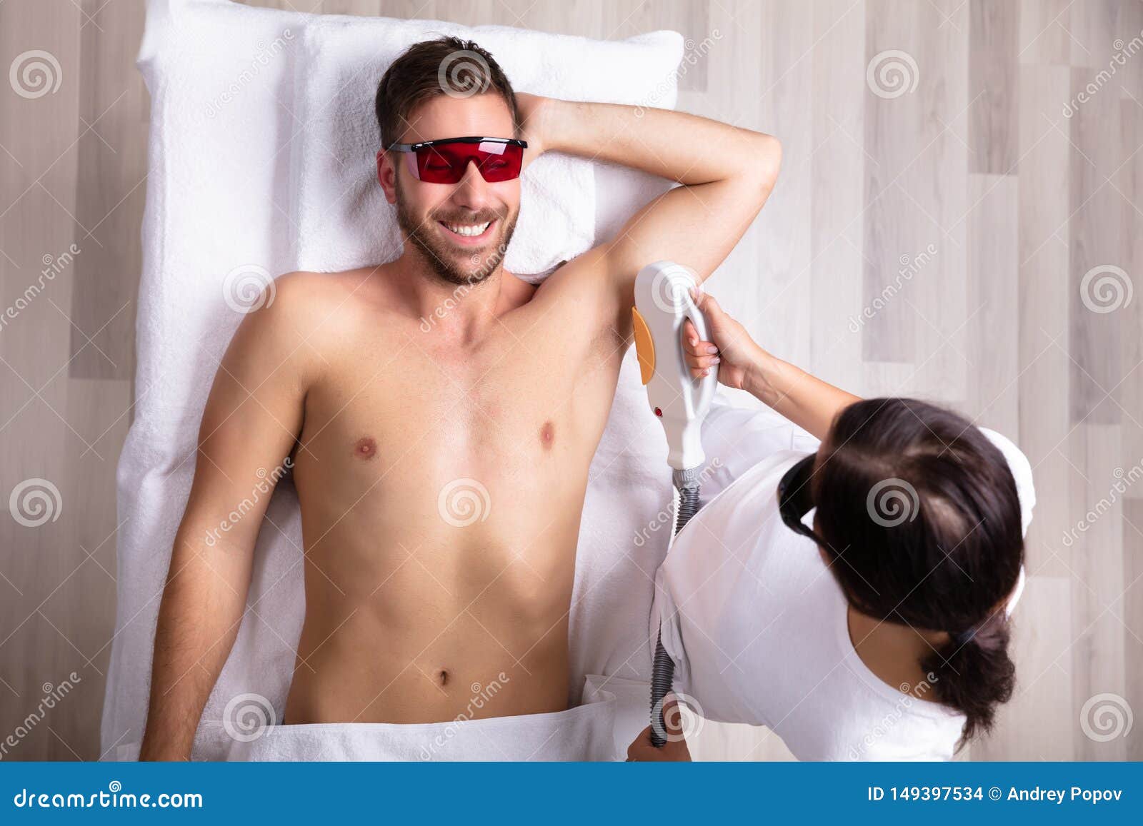 Young Man Having Underarm Laser Hair Removal Treatment Stock Photo - Image  of armpit, depilation: 149397534