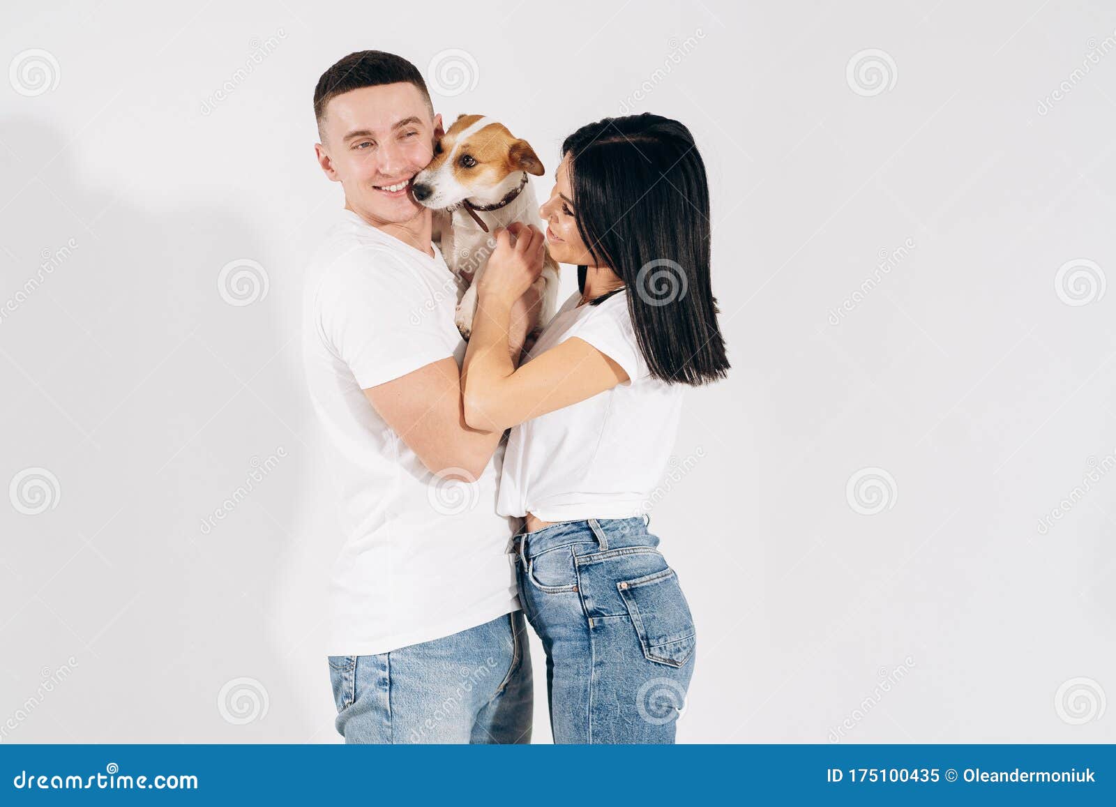 Young Man and Her Boyfriend with Their Dog at Studio. Young Owners Kissing  Pet. Young and Beautiful Couple Holding Dog Stock Image - Image of love,  lifestyle: 175100435