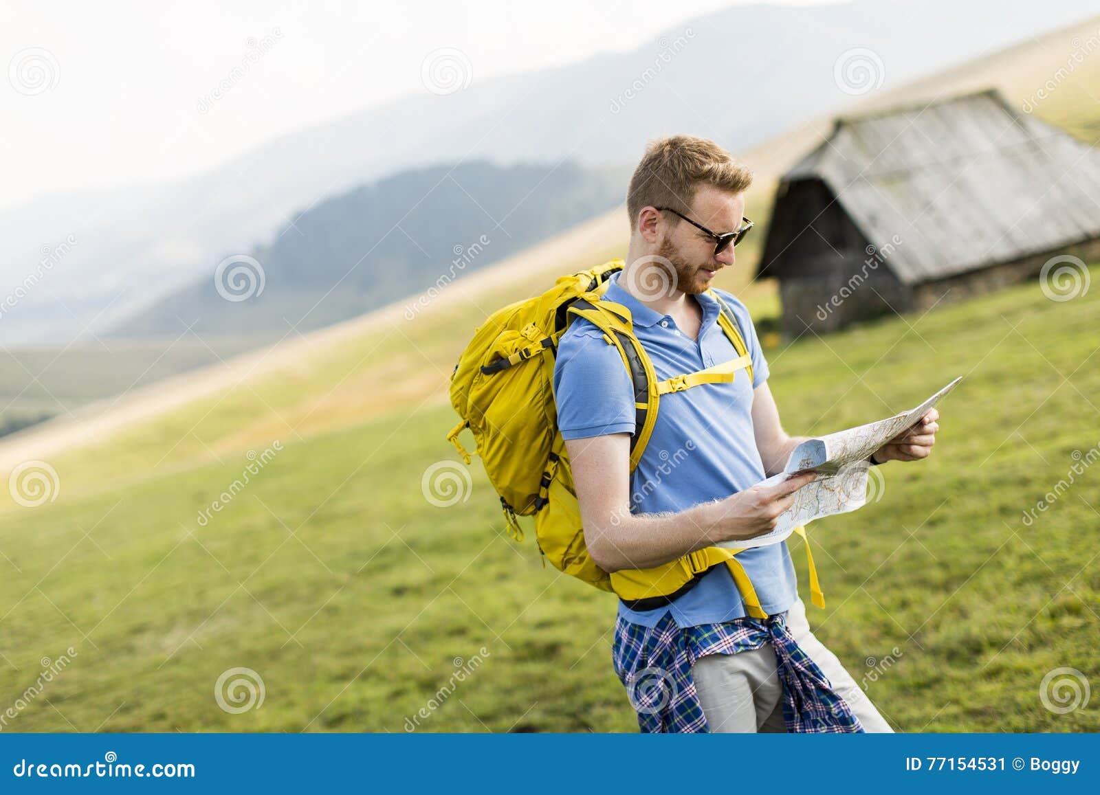 Young man hiking stock image. Image of explore, backpack - 77154531