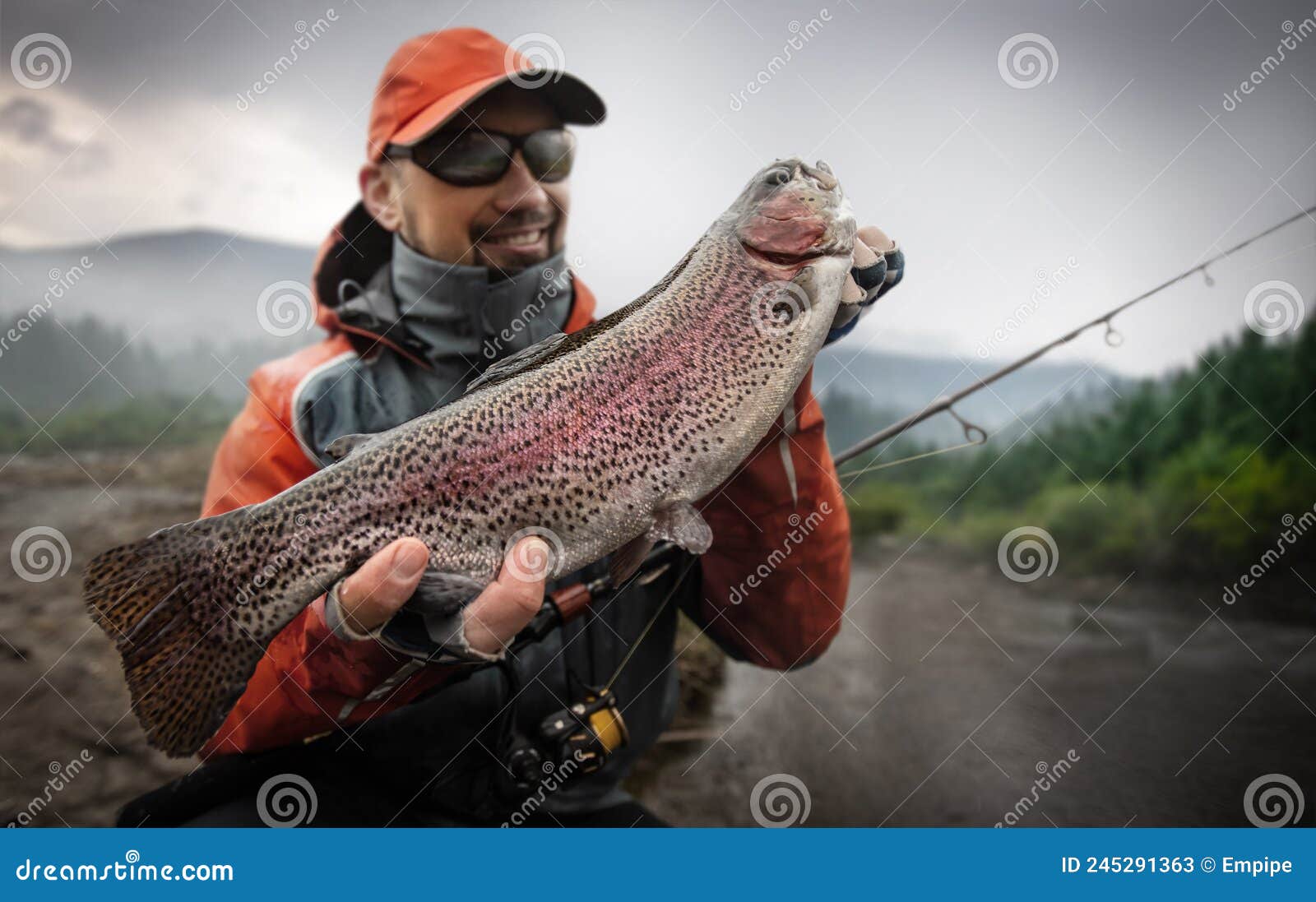 Young Man Hold Big Rainbow Trout in His Hands. Stock Image - Image of  cheerful, salmon: 245291363