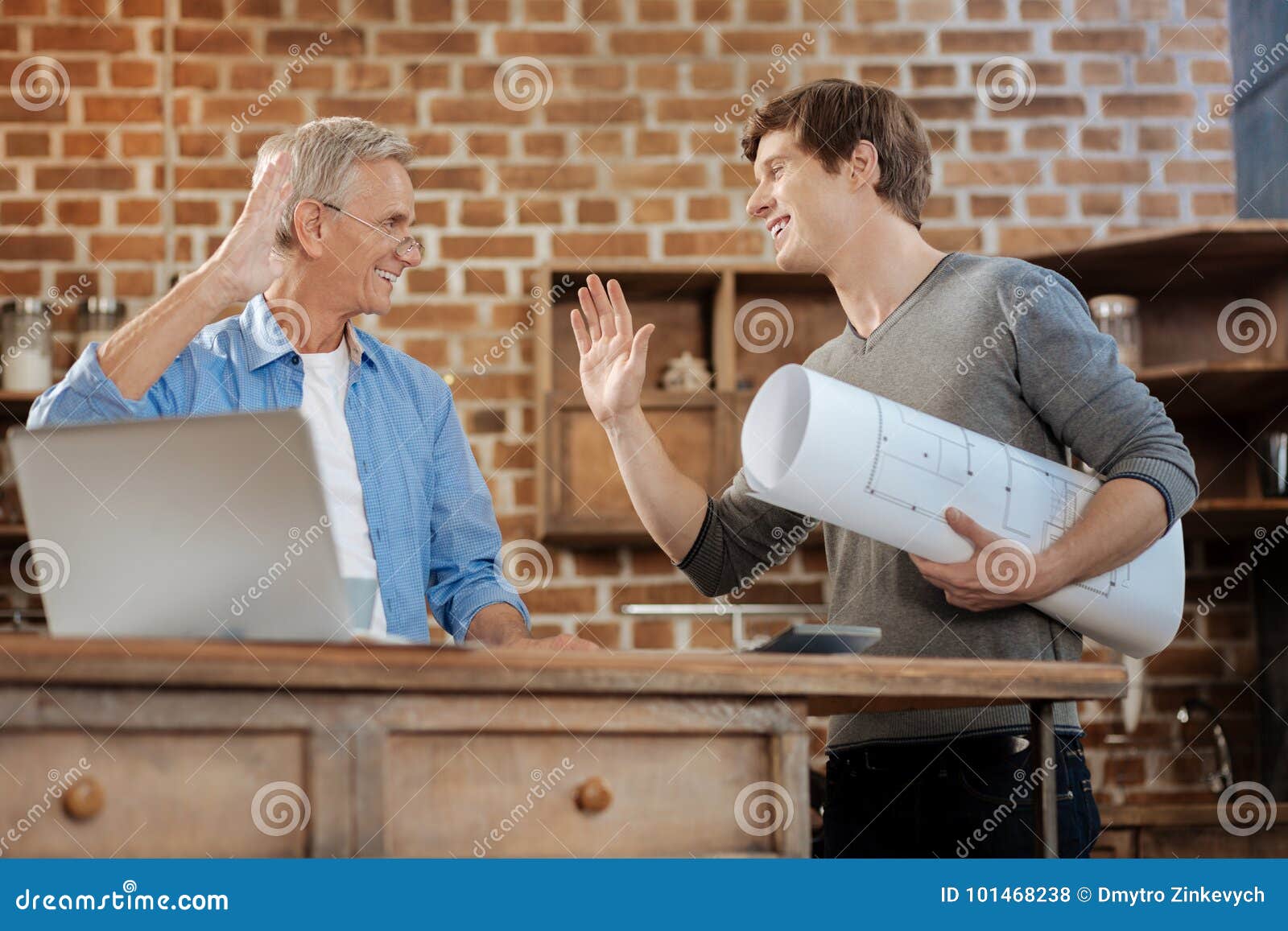 Young Man Holding and His Mentor Stock Photo - of gadget, 101468238