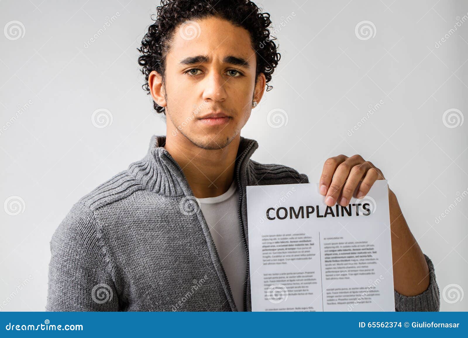 young man holding complaints report