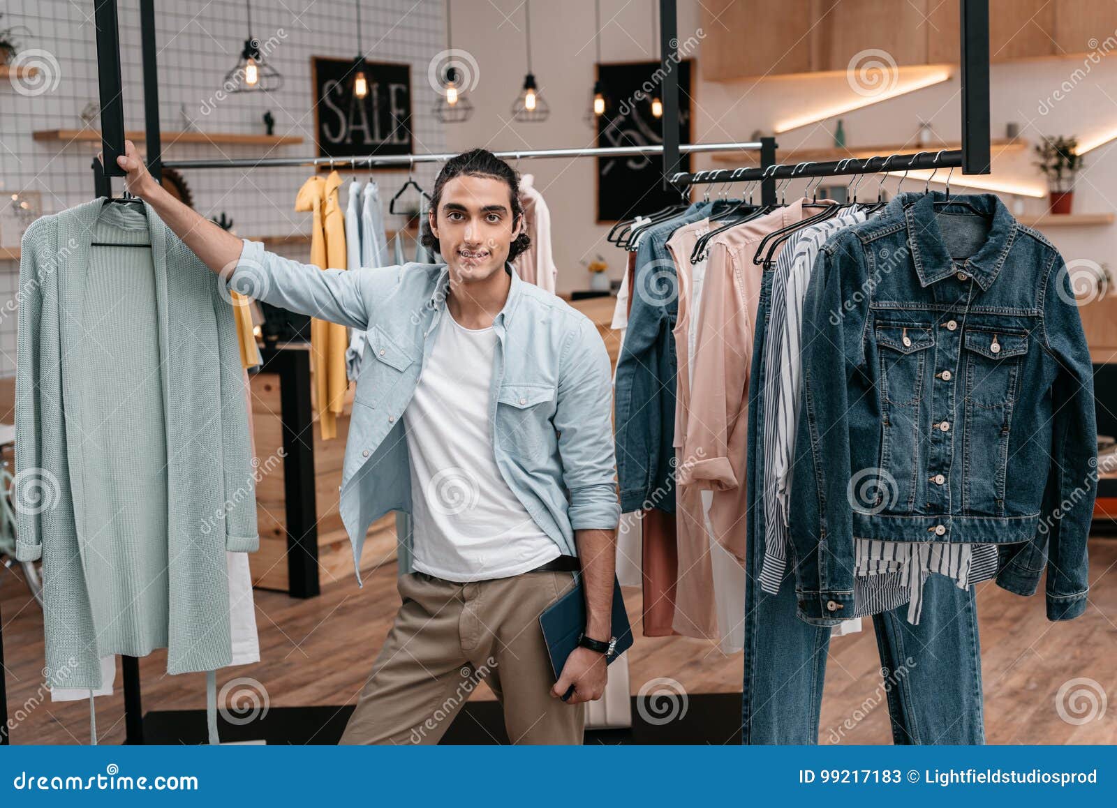 Young Man Holding Digital Tablet and Smiling at Camera while Working in ...