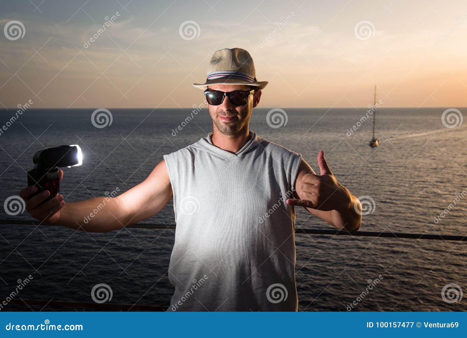 Young Man Holding Flash, Sea View in Background Stock Image - Image of ...