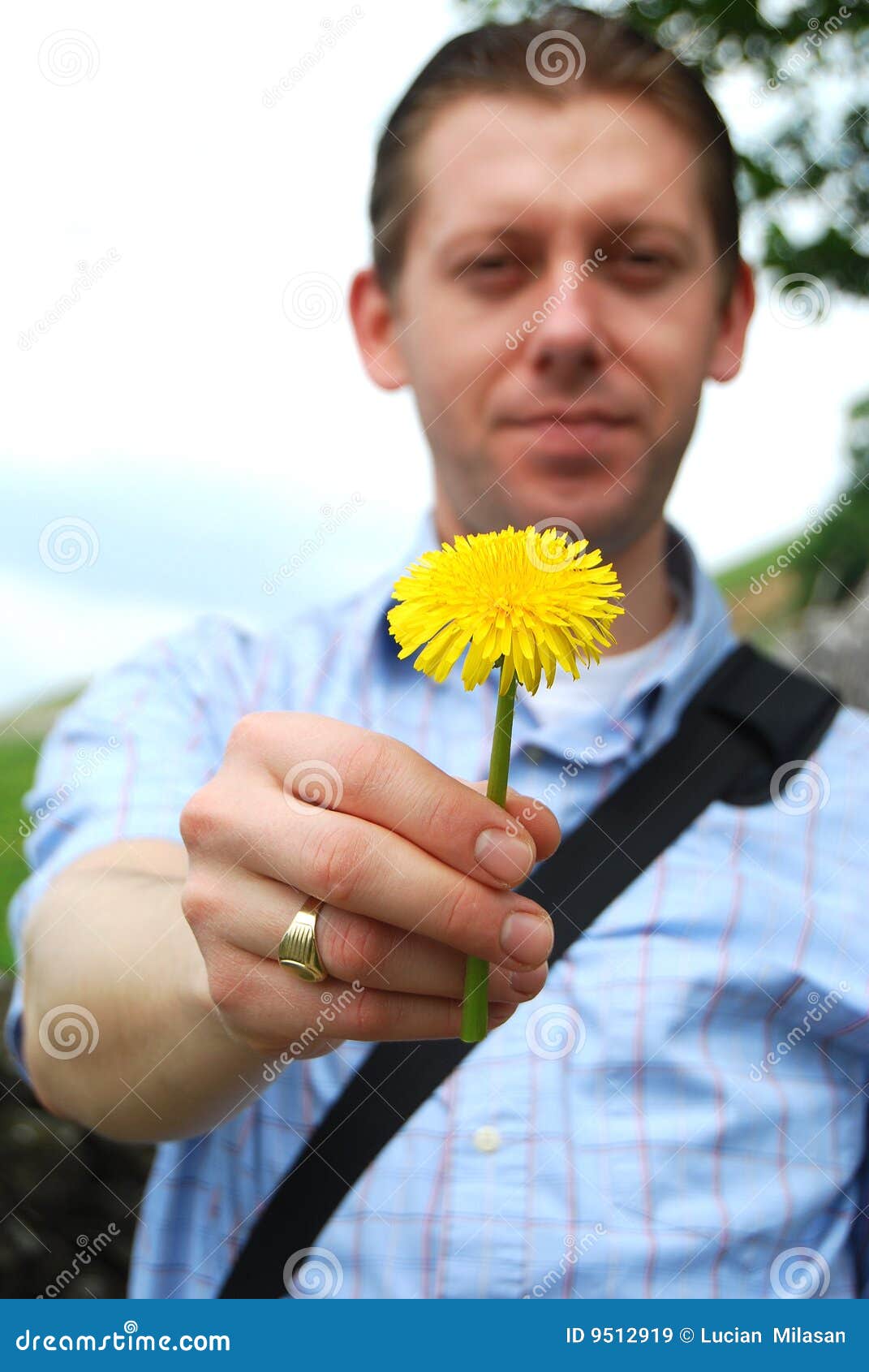 Young man holding a flower stock image. Image of smile 9512919