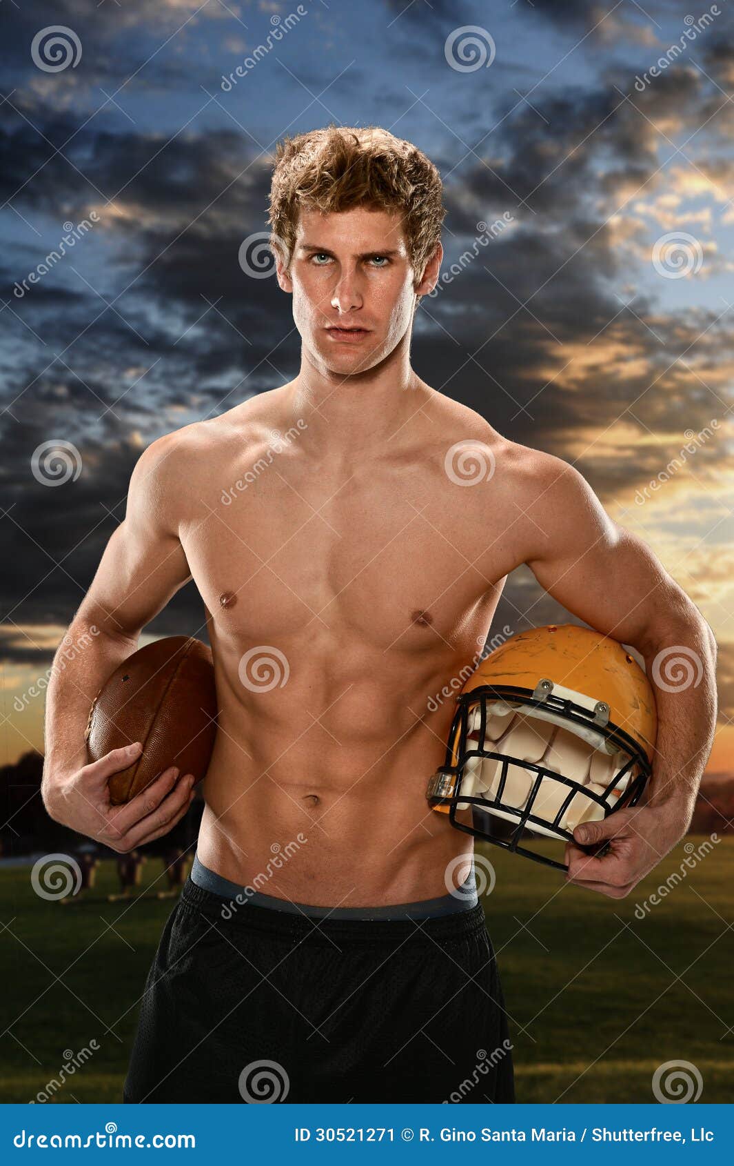 Young Man Holding Football And Helmet Stock Image - Image: 30521271