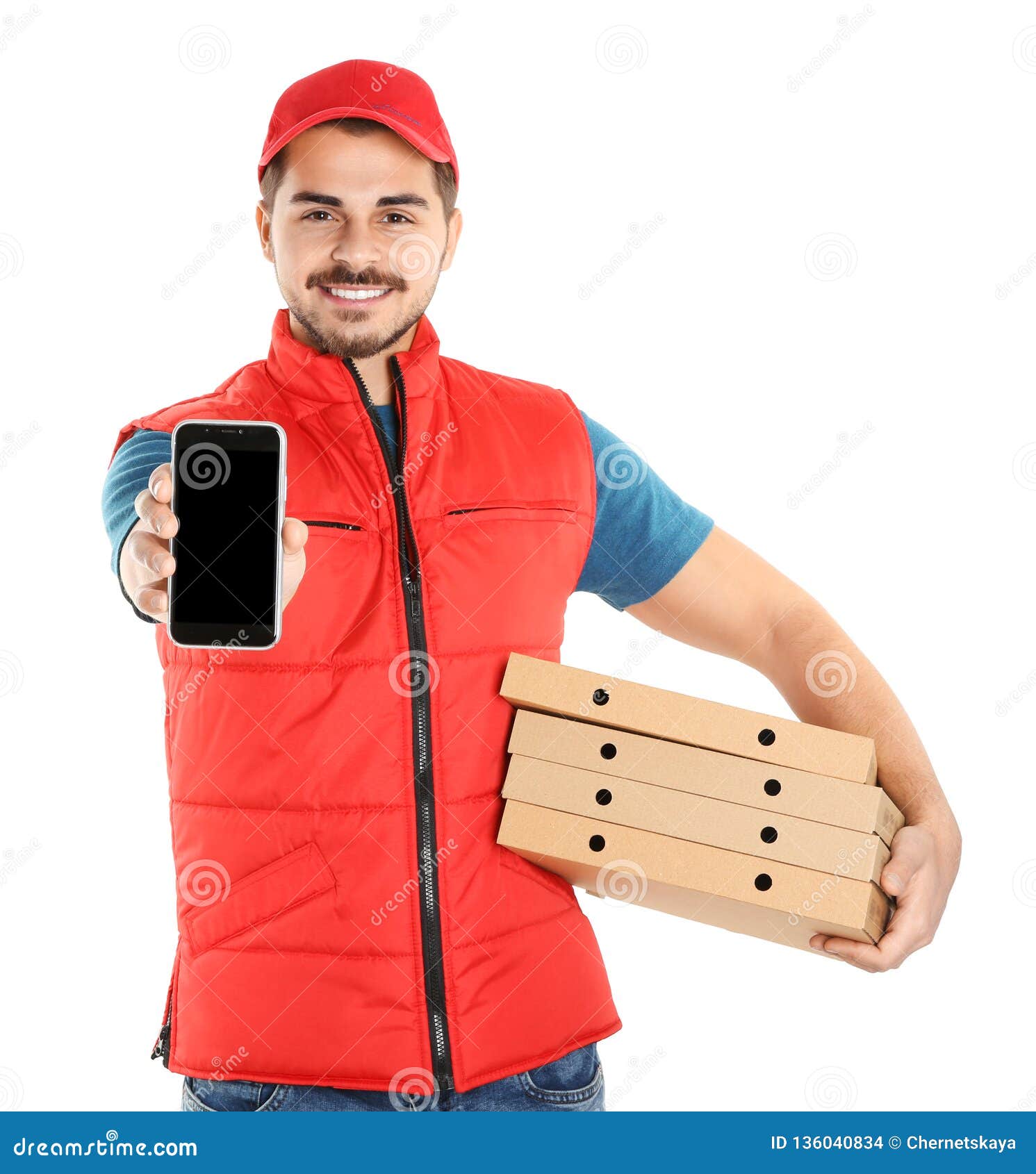 Young man holding pizza boxes and smartphone isolated on white, mockup for design. Online food delivery