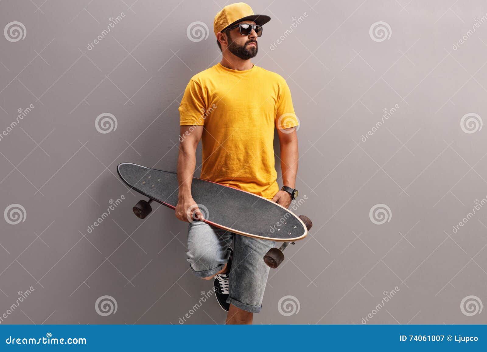 Young Man Holding a Skateboard Stock Image - Image of hipster ...