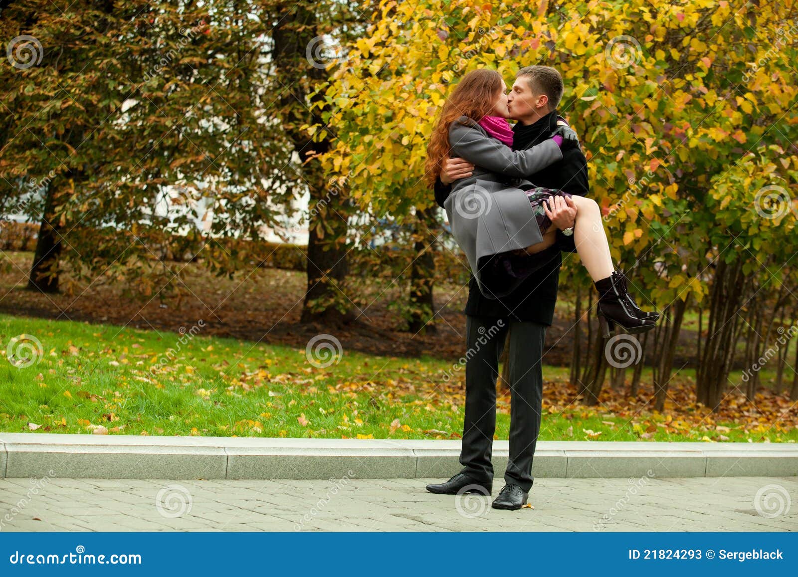 Young man holding woman stock image. Image of people 21824293