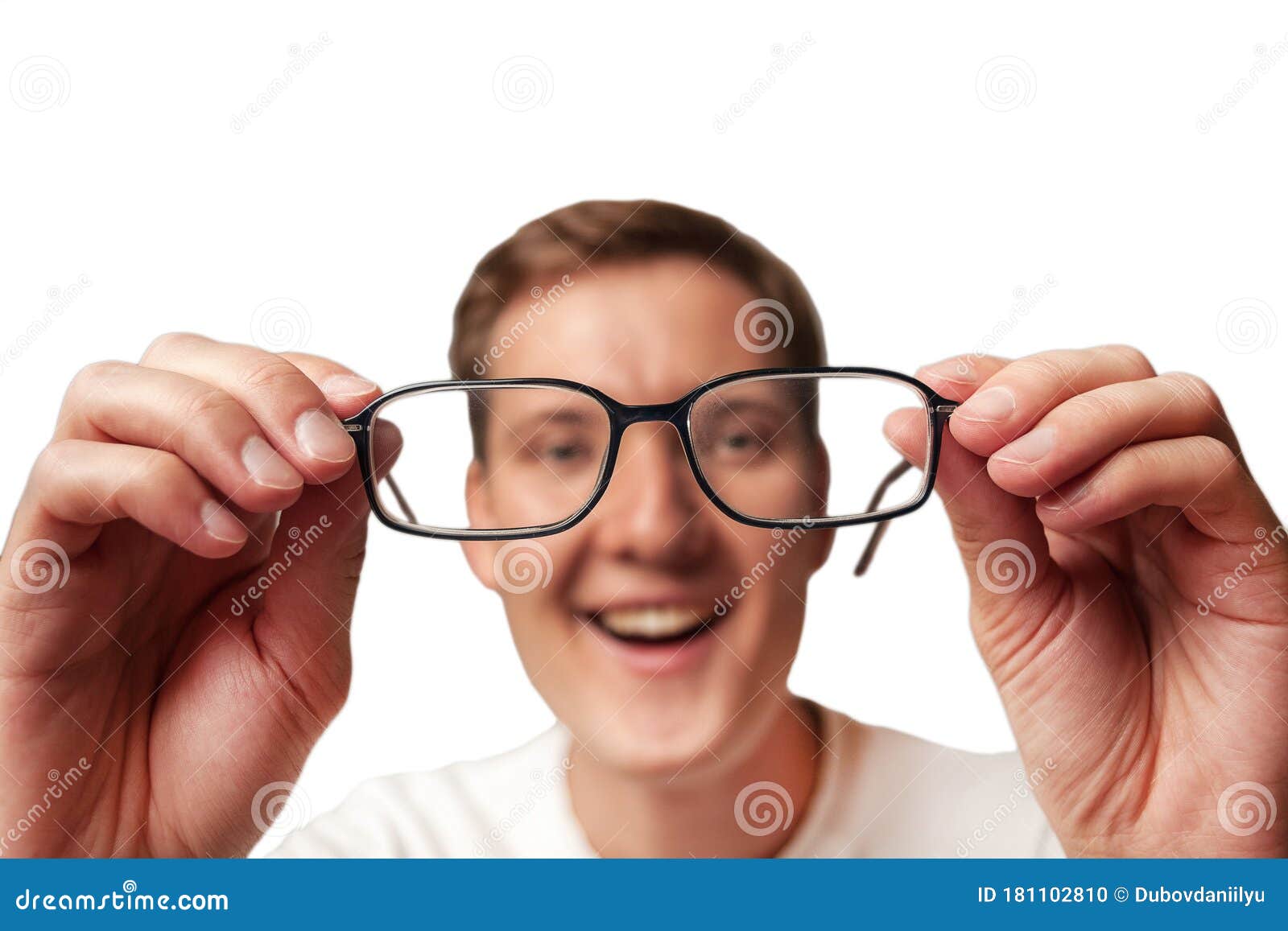 The Young Man Holds Glasses With Diopter Lenses And Looks Through Them ...