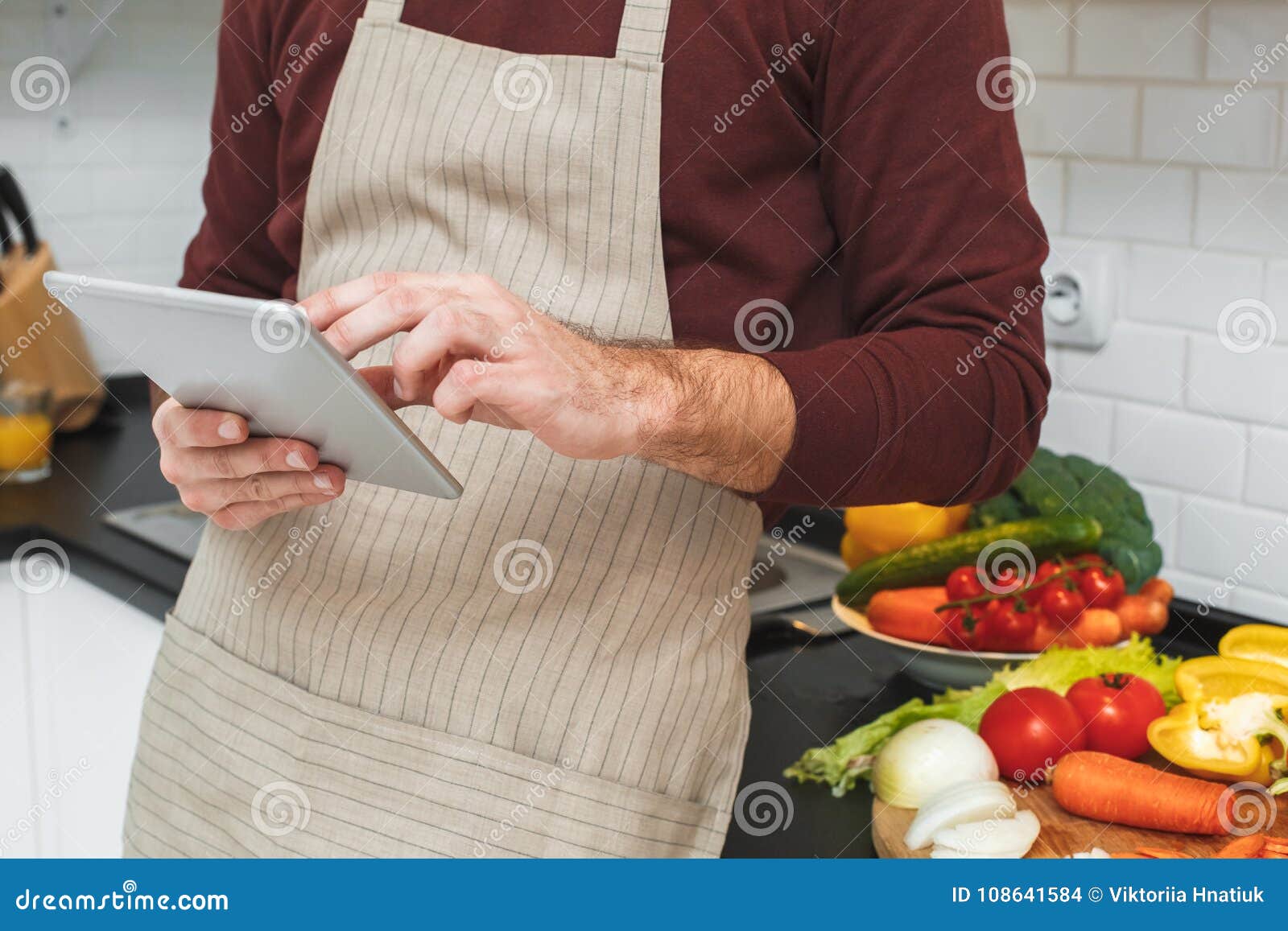 Young Man Cooking Romantic Dinner at Home Browsing Digital Tablet Close ...